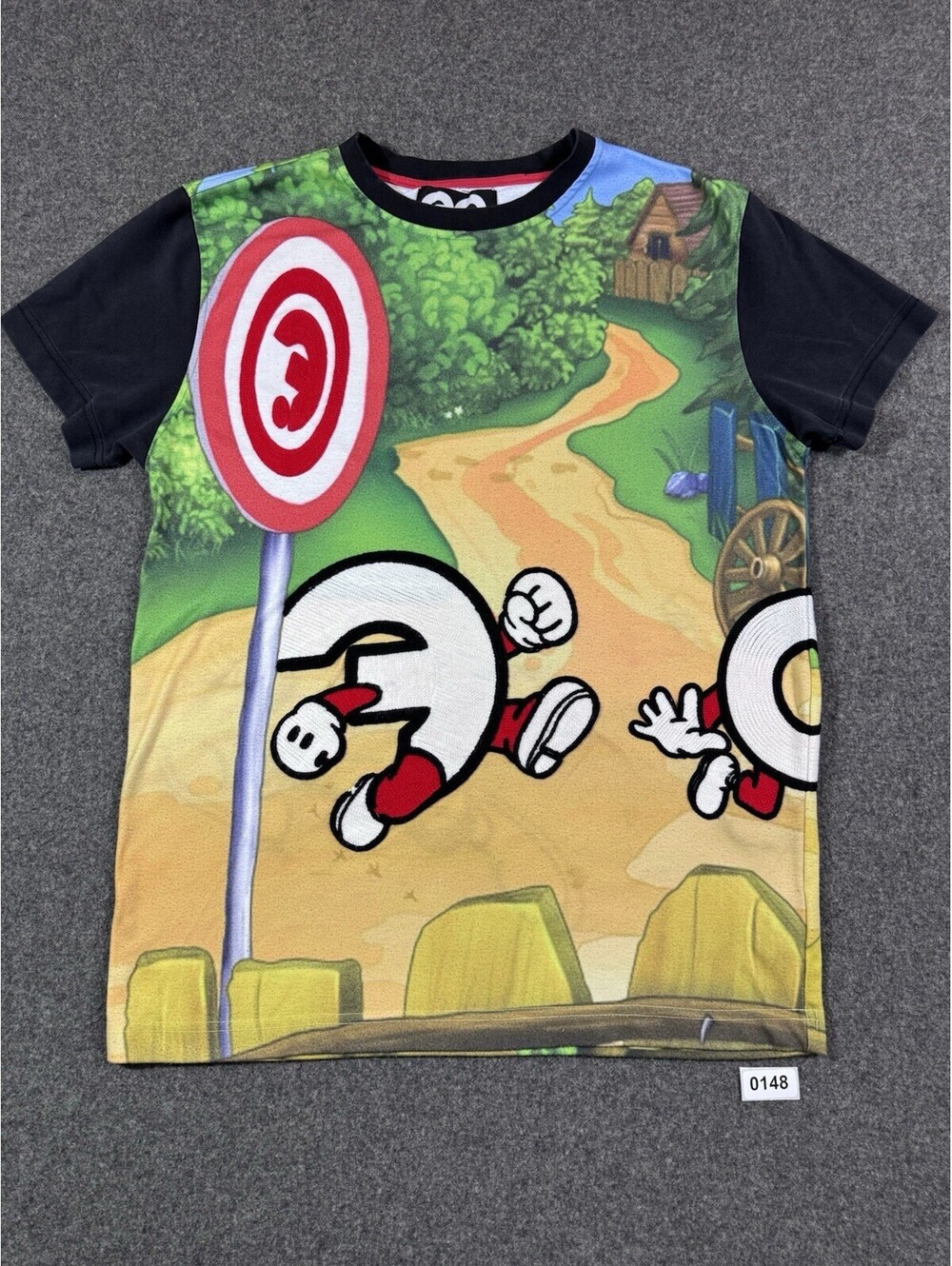 Vintage Y2K T-shirt with cartoon notebook print and countryside scene. Size: L